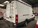a white van that is parked in a garage