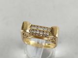 a close up of a gold ring with diamonds on it