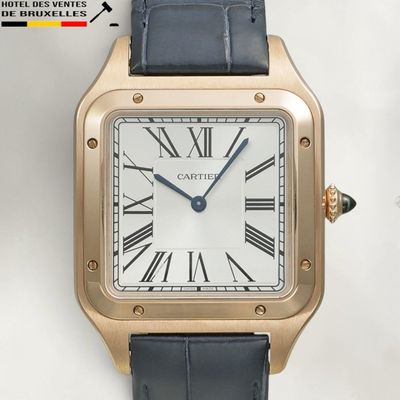une image d'un gros plan d'une montre-bracelet avec des chiffres romains