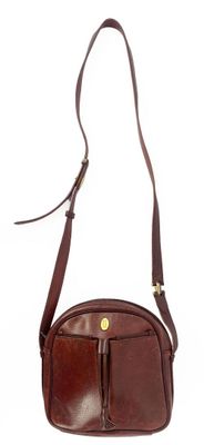 brown leather cross body bag on white background with strap