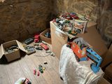 a pile of toys on the floor of a room