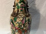 a vase that is sitting on a white surface