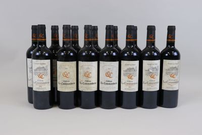 six bottles of wine are lined up in a row on a white surface