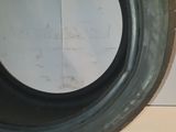 a close up of a tire tire on a white surface