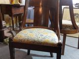 a chair that is sitting in the middle of a room