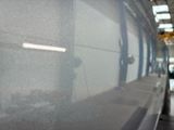 a reflection of a car in the window of a building
