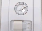 a white box with a charger inside of it