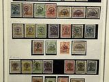 a framed picture of a collection of stamps on display in a frame