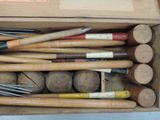 a box full of different types of baseball bats