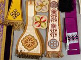many different types of cloths hanging on a wall