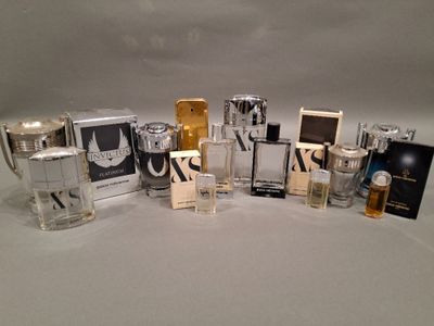 many different types of perfumes on a white surface