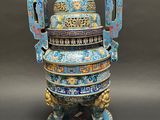 an image of a blue vase with a lion on top of it