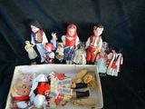 a box full of dolls that are sitting on a table