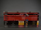a lot of dvds stacked on top of each other