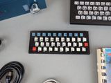 a keyboard, mouse, and other electronic equipment on a table