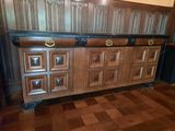 a large wooden cabinet with many drawers on it