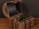 a small wooden box with a lid on a wooden table