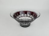 an image of a red and white bowl on a white surface