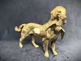a statue of a dog holding a bird in its mouth