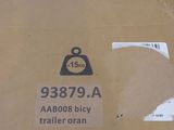 a cardboard box with a sticker on it and a tag on it