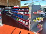 many shelves in the store that have various items on them