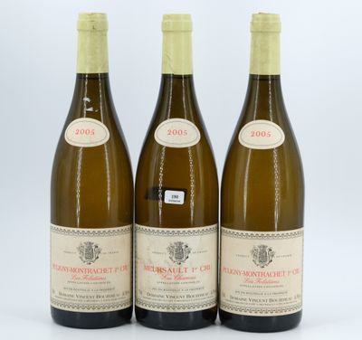 three bottles of wine sitting next to each other on a white surface
