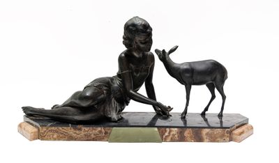 bronze statue of a woman and a deer on a marble base