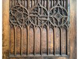 an old wooden door with a decorative design on it