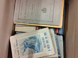 a box full of books sitting on top of a table