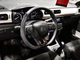 a car dashboard with a steering wheel and a dash board