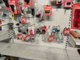 a wall with many different items on it in a store