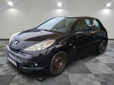a picture of a small black car parked in a garage