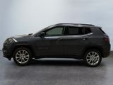 the jeep compass is parked in a large room with a white wall