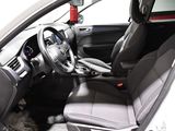 the interior of a white car with black seats and a steering wheel