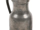 a metal pitcher with a handle on a white background