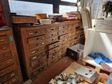a room with a lot of drawers and boxes on the floor