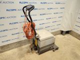 a machine that is sitting on the floor in a room