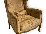 an image of a chair with a floral upholstered back and arms
