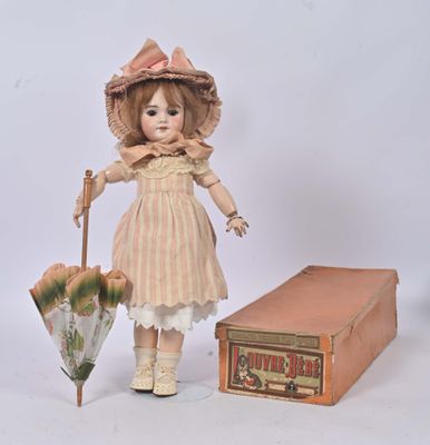 a doll that is standing next to a box and an umbrella