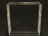 a clear acrylic display case with a black background