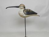 an image of a bird on a metal stand
