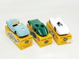 three toy cars that are sitting on top of each other