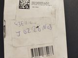 a box that is sitting on a table with a barcode on it