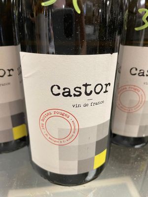 three bottles of wine sitting on top of a table next to each other