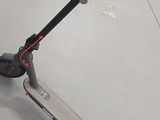 a scooter that is sitting on the concrete floor