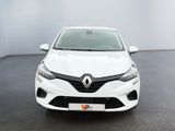 the front view of a white car parked in a showroom