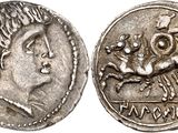 a silver coin with an image of a man and a woman on it