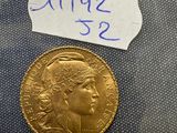 a close up of a gold coin with a price tag on it