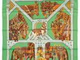 a green scarf with a picture of elephants and people on it