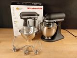 an image of a kitchen aid mixer on a wooden table